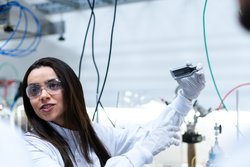 Female scientist conducts experiment in laboratory 